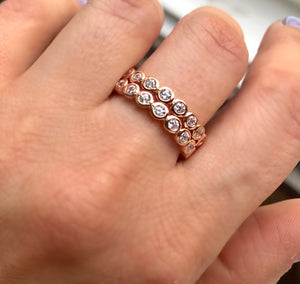 Pave-set ring with large round clear zircon stones