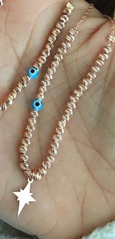 Charm necklace with silver beads evil eye talisman and charms