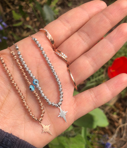 Charm necklace with silver beads evil eye talisman and charms